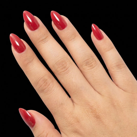 Bold Move press-on nail set - short almond nails in classic true red with glossy finish, fan pose arrangement