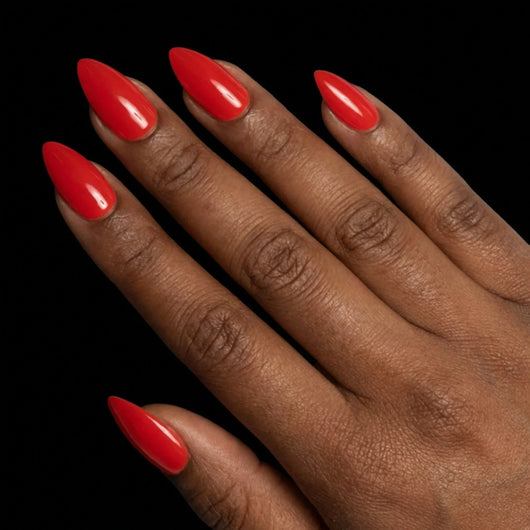 Short Almond in Red press-on nails on deep skin tone - Cherry on Top Instant Manicure.