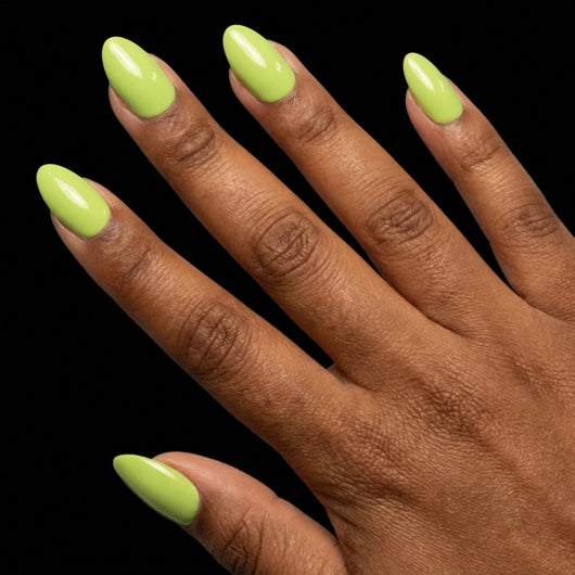 Short Oval in Green press-on nails on deep skin tone - Electric Lime Instant Manicure.