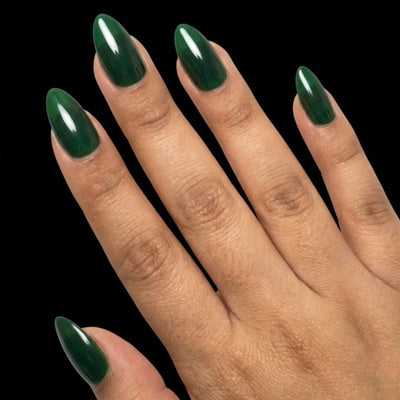 Short Oval in Green press-on nails on medium skin tone - Emerald Forest Instant Manicure.