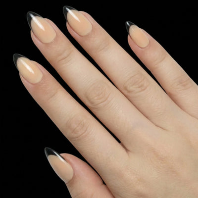 Short Almond in Nude French Tip press-on nails on light skin tone - French Noir Instant Manicure.