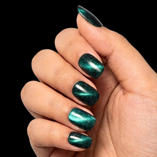 Midnight Lagoon press-on nail set - extra-short squoval nails in deep navy-teal with glossy finish, dorsal view