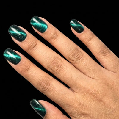 Midnight Lagoon press-on nail set - extra-short squoval nails in deep navy-teal with glossy finish, fan pose arrangement