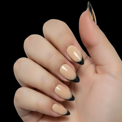 French Noir press-on nail set - short almond nails with nude base and black French tips, dorsal view