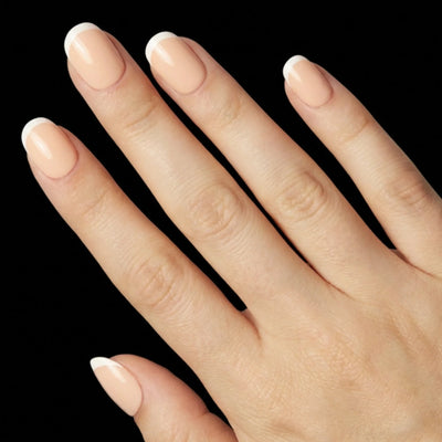 Short Squoval in Nude French Tip press-on nails on light skin tone - Petite French Instant Manicure.