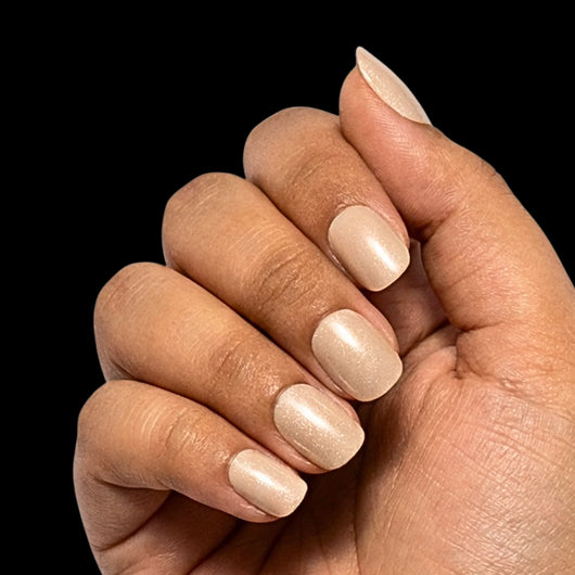 Nude Elegance press-on nail set - extra-short squoval nails in warm rosy-nude with glossy finish, dorsal view