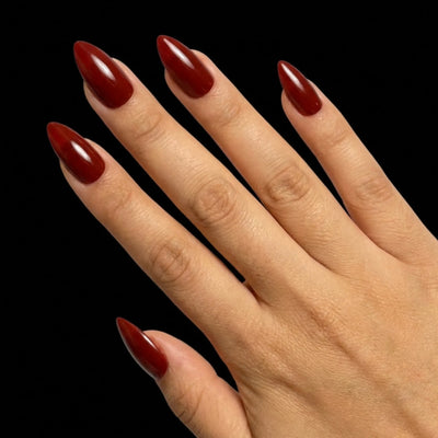 Spiced Cider press-on nail set - short almond nails in warm spiced cider-brown with glossy finish, fan pose arrangement