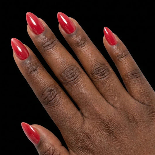 Short Almond in Red press-on nails on deep skin tone - Bold Move Instant Manicure.