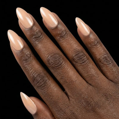 Short Almond in Nude press-on nails on deep skin tone - Champagne Toast Instant Manicure.