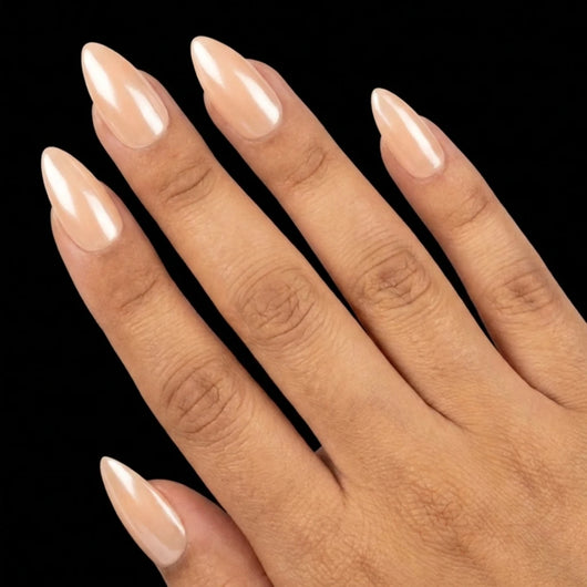 Short Almond in Nude press-on nails on medium skin tone - Champagne Toast Instant Manicure.