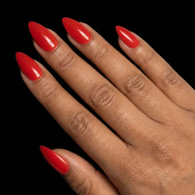 Short Almond in Red press-on nails on medium skin tone - Cherry on Top Instant Manicure.