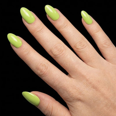 Short Oval in Green press-on nails on light skin tone - Electric Lime Instant Manicure.
