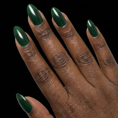 Short Oval in Green press-on nails on deep skin tone - Emerald Forest Instant Manicure.