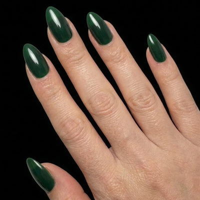 Short Oval in Green press-on nails on light skin tone - Emerald Forest Instant Manicure.
