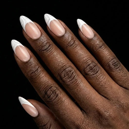 Short Almond in Nude French Tip press-on nails on deep skin tone - French Kiss Instant Manicure.
