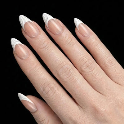 Short Almond in Nude French Tip press-on nails on light skin tone - French Kiss Instant Manicure.