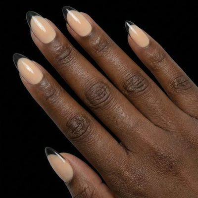 Short Almond in Nude French Tip press-on nails on deep skin tone - French Noir Instant Manicure.