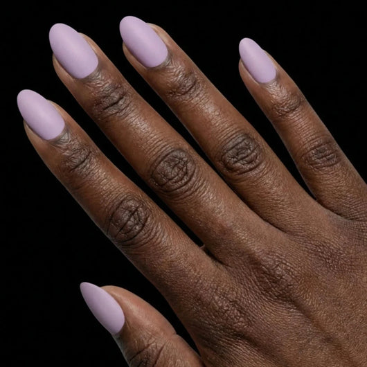 Short Oval in Lavender press-on nails on deep skin tone - Lavender Fields Instant Manicure.