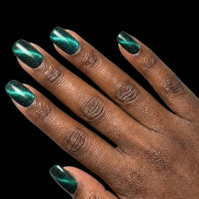Short Squoval in Teal press-on nails on deep skin tone - Midnight Lagoon Instant Manicure.