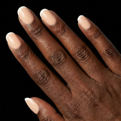 Short Squoval in Nude French Tip press-on nails on deep skin tone - Petite French Instant Manicure.
