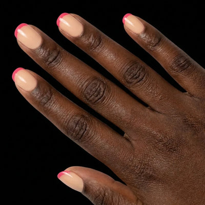 Short Squoval in Pink French Tip press-on nails on deep skin tone - Pink Pop Instant Manicure.