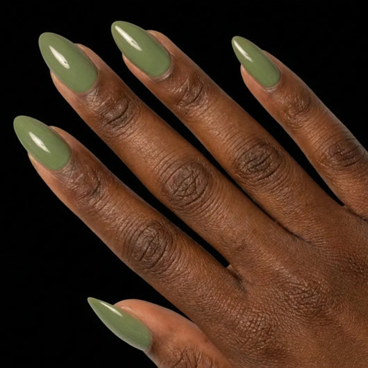 Short Almond in Green press-on nails on deep skin tone - Sage Garden Instant Manicure.
