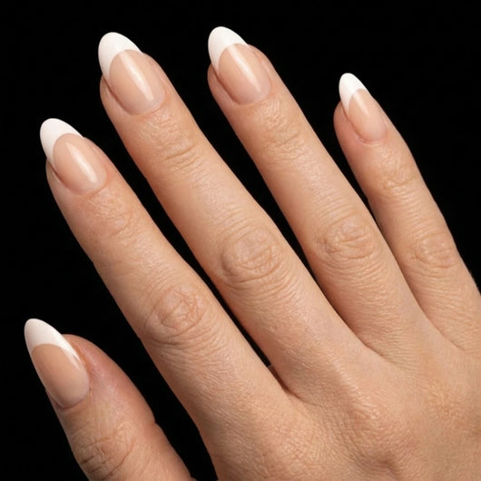 Short Oval in Nude French Tip press-on nails on light skin tone - Soft French Instant Manicure.